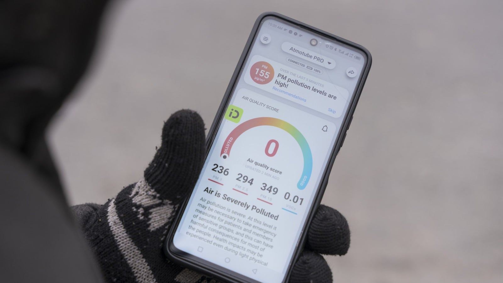 A phone showing the air quality through the Atmotube app in Lahore.
