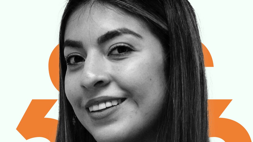 A black and white headshot of Melina Cruz against an orange and light green background.