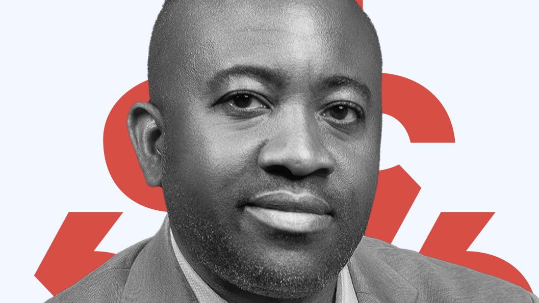 A headshot of Oswald Osaretin Guobadia placed over red diacritics and a light blue background.