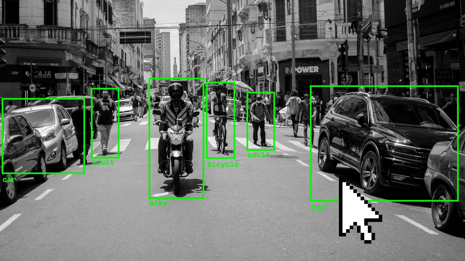 A black and white photo of a street in Brazil with green rectangles over vehicles and people and an illustration of a large sized cursor.
