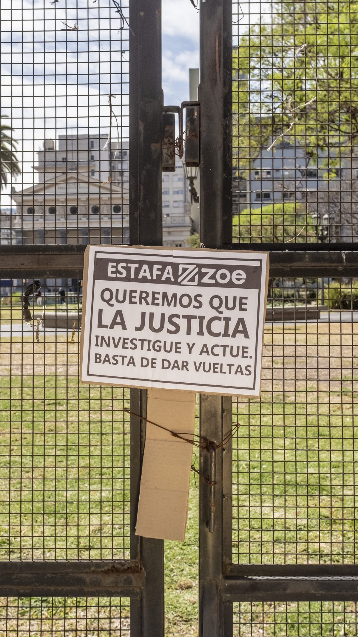 A photo showing a sign tied to a fence during a protest against Generation Zoe in Argentina.