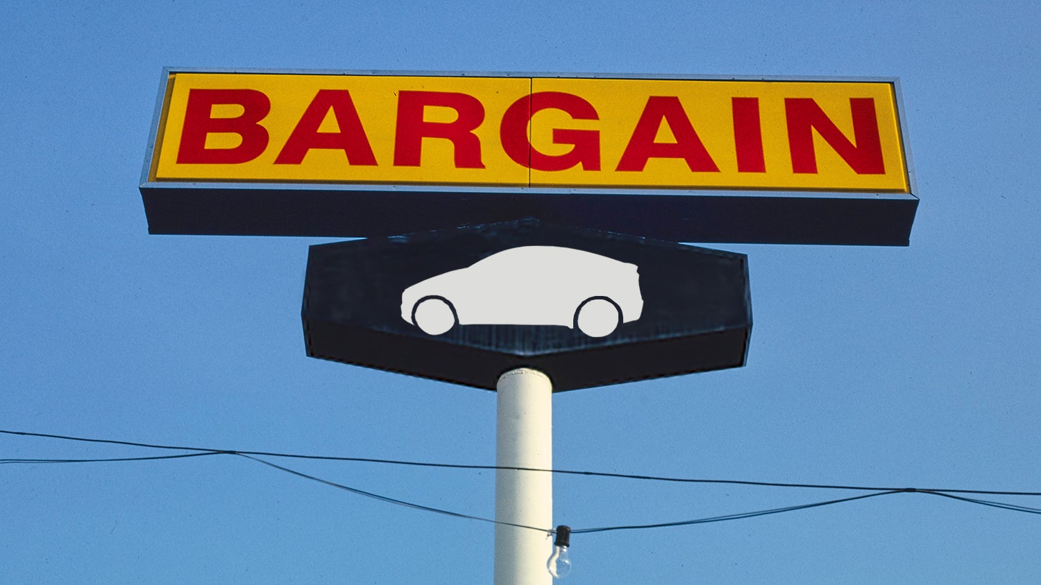 A large sign displaying the word 'BARGAIN' in bold red letters, with a black panel underneath featuring a white silhouette of a car, against a clear blue sky backdrop.