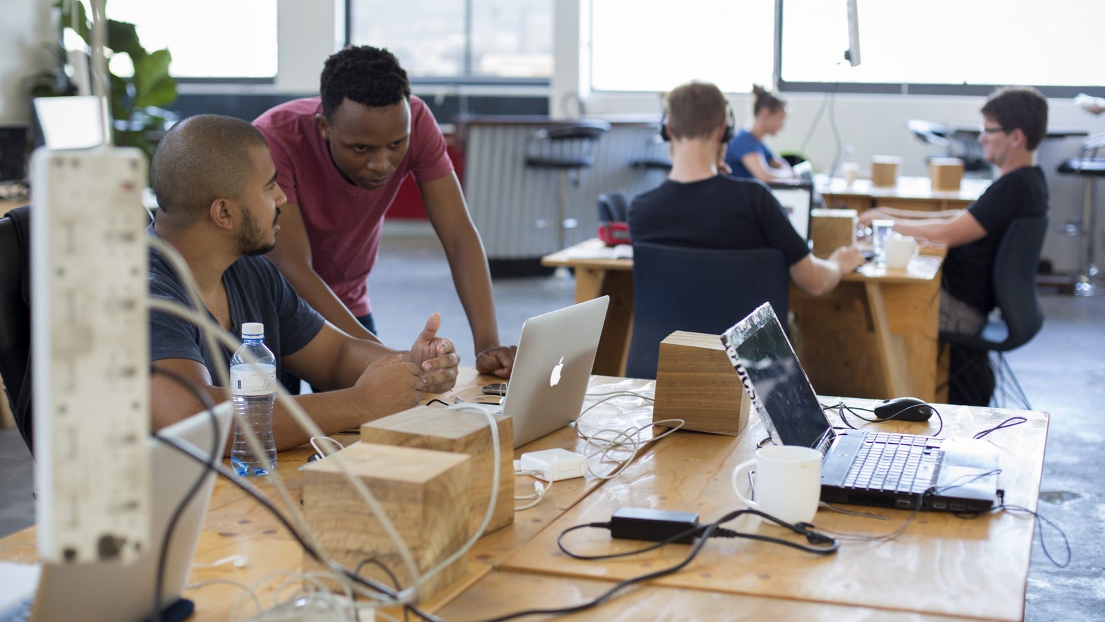 Techies work in a shared office space called Woodstock Exchange, where entrepreneurs and small businesses rent office space on November 22, 2016 in Woodstock outside central Cape Town, South Africa.