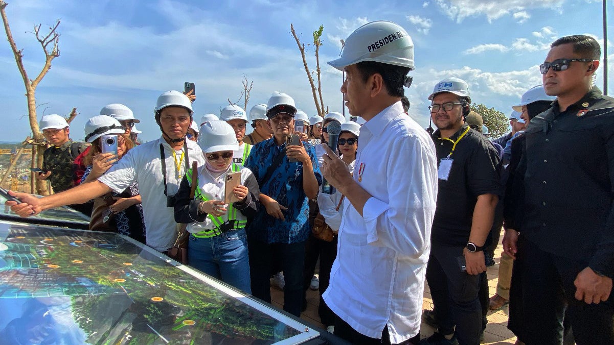 Indonesia President Joko Widodo showing a group of influencers a plan of the Nusantara city.