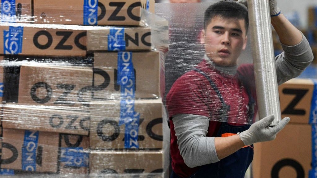 A worker at Russia online retailer Ozon's logistics centre, outside the town of Iver.