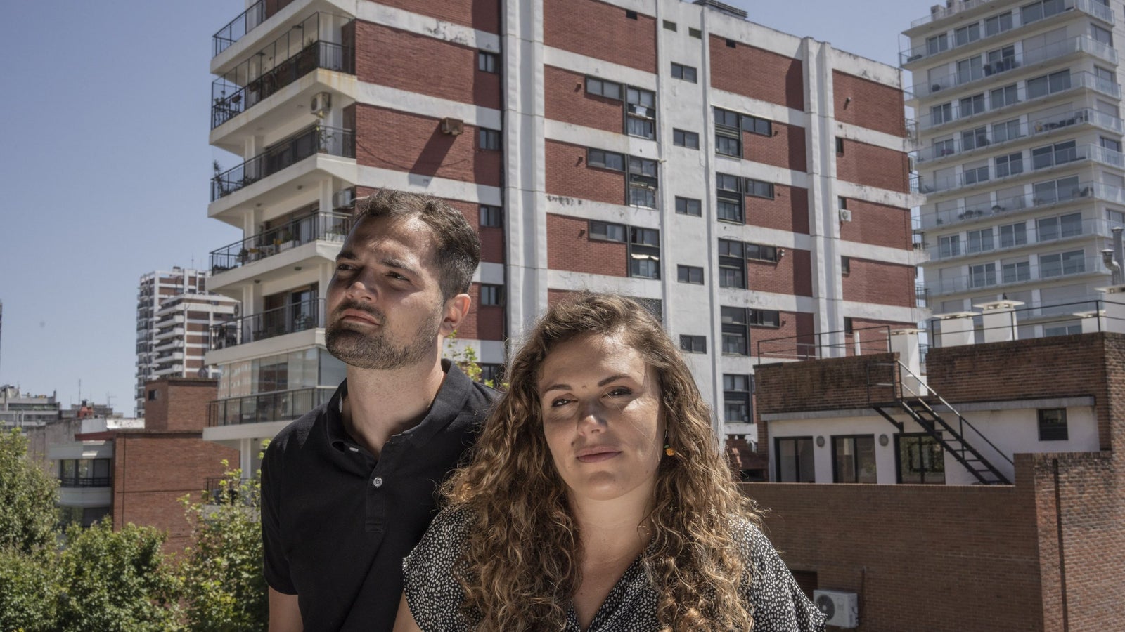 A photo of two people on a balcony in Argentina.