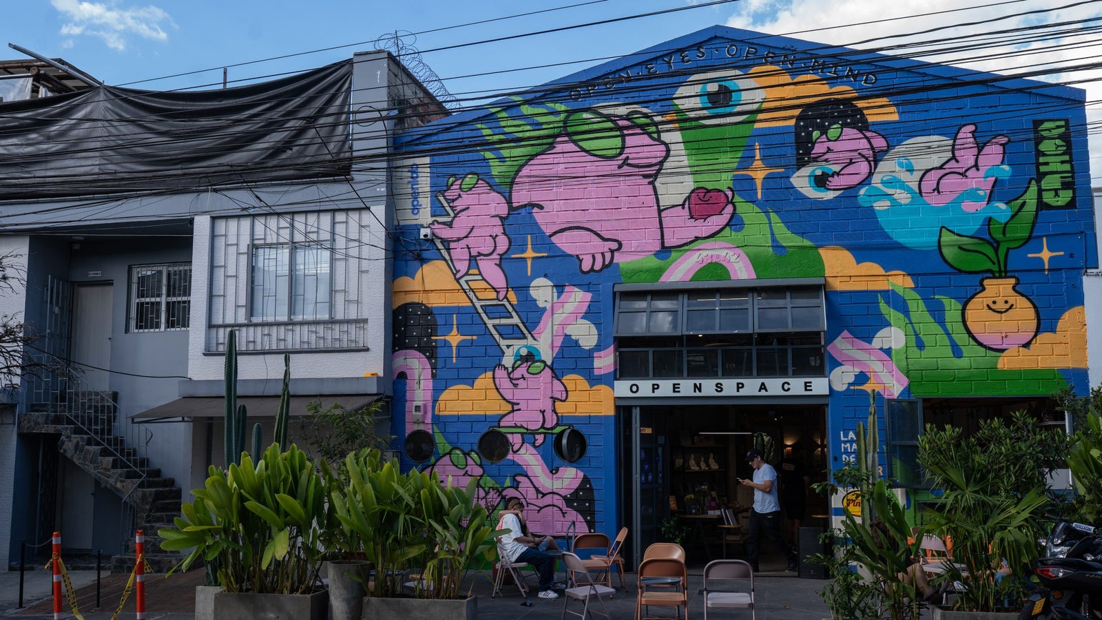 A photo showing the exterior of a colorfully painted co-working space in Medellín, Colombia.