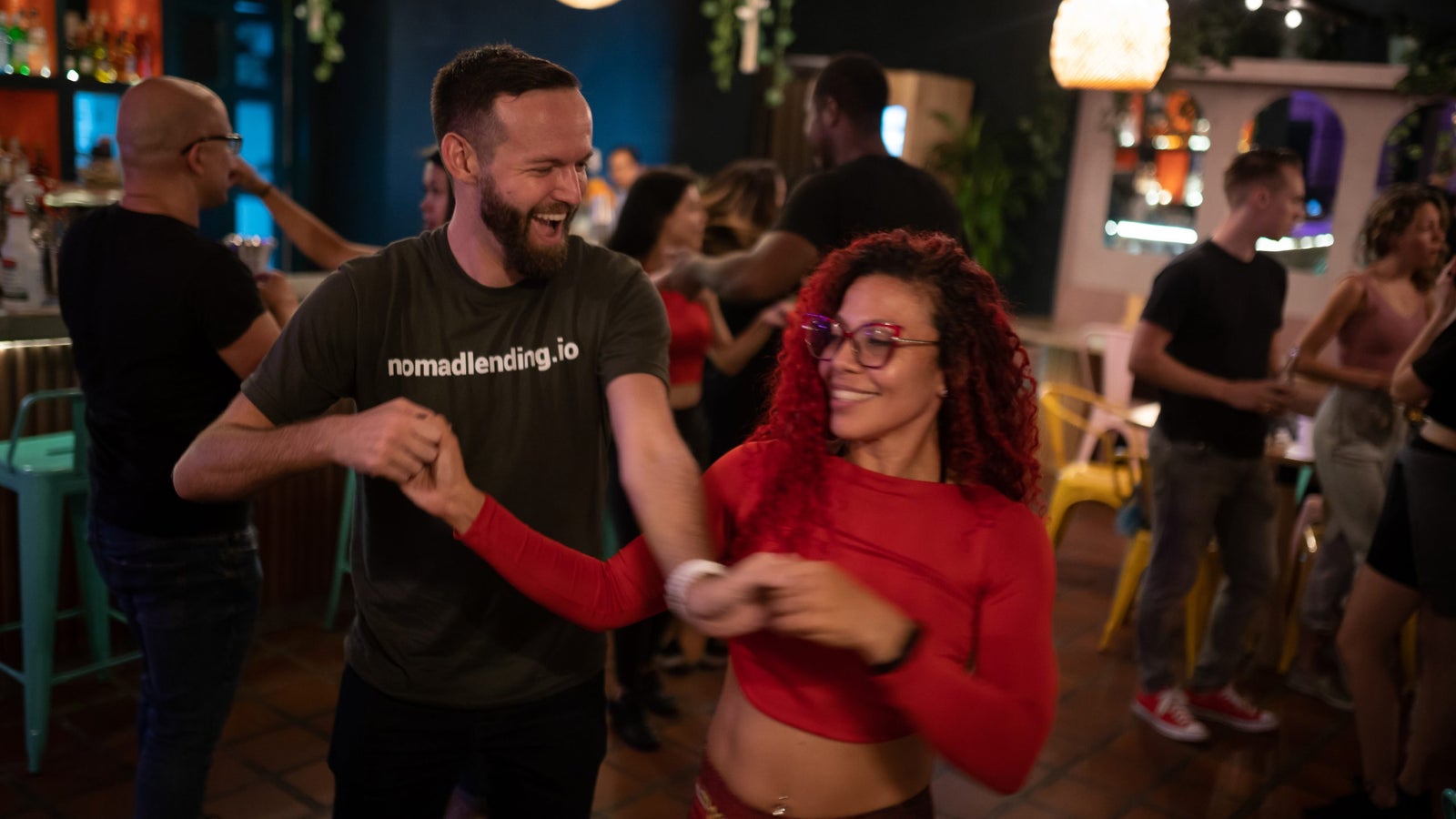 A photo of a man and woman dancing at a bar in Colombia.