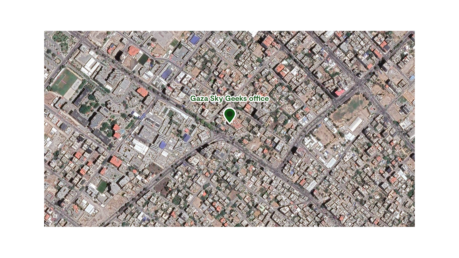 Satellite view of a city with a marker for Gaza Sky Geeks office at the center.